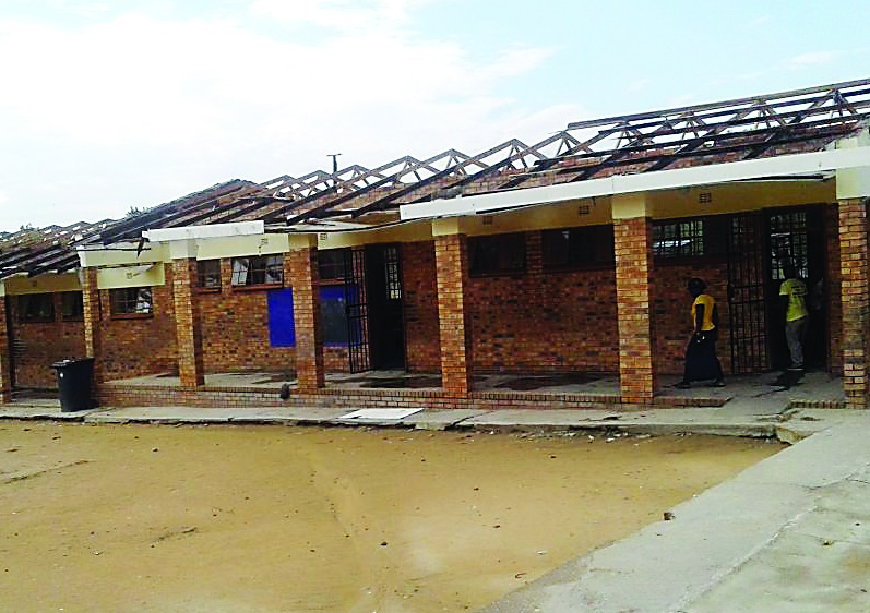 Parents are demanding that the school repair the four classrooms that had their roofs blown off.      Photo by AENS 