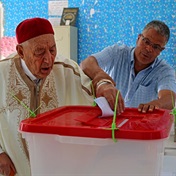 Tunisians begin to vote in referendum on new constitution
