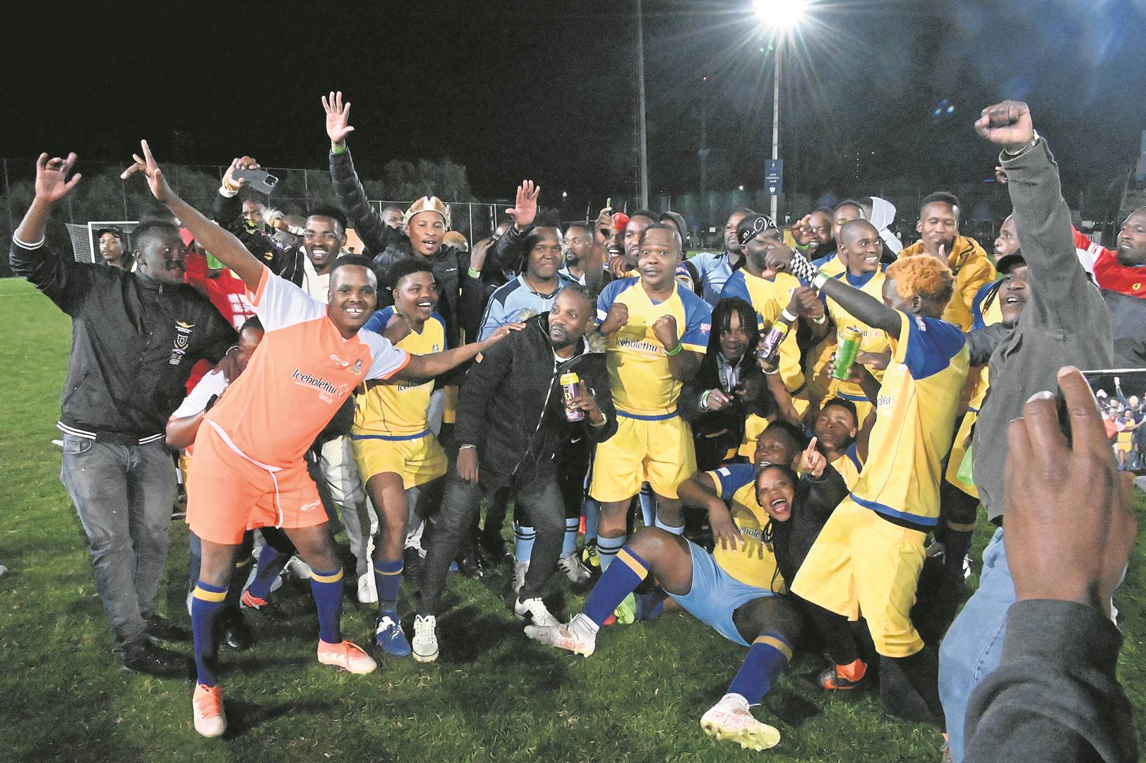 The maskandi team celebrate after winning the Celebrity soccer tournament at Wits Football Stadium at the weekend. Inset: Cassper Nyovest, DJ Tira and Big Zulu sharing a light moment before the matches kicked off.         Photos by Gallo Images/Oupa Bopape