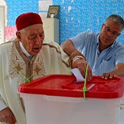 Tunisians back new constitution, but with low turnout