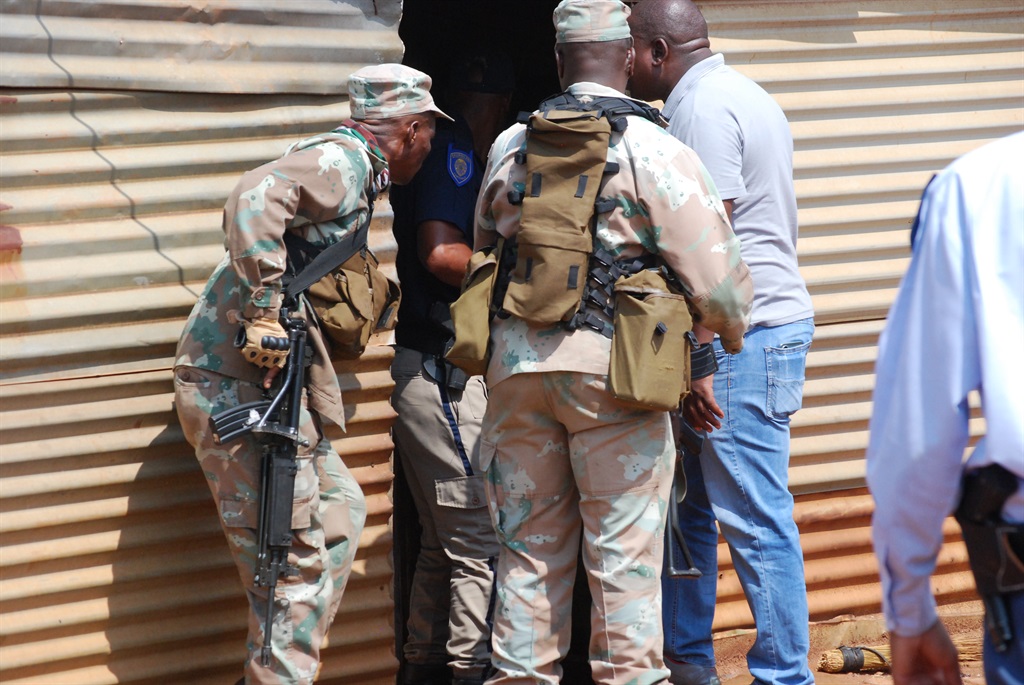 Police and soldiers raiding zama zamas at Gugulethu and Everest squatter camps in Springs. Photo by Khaya Masipa