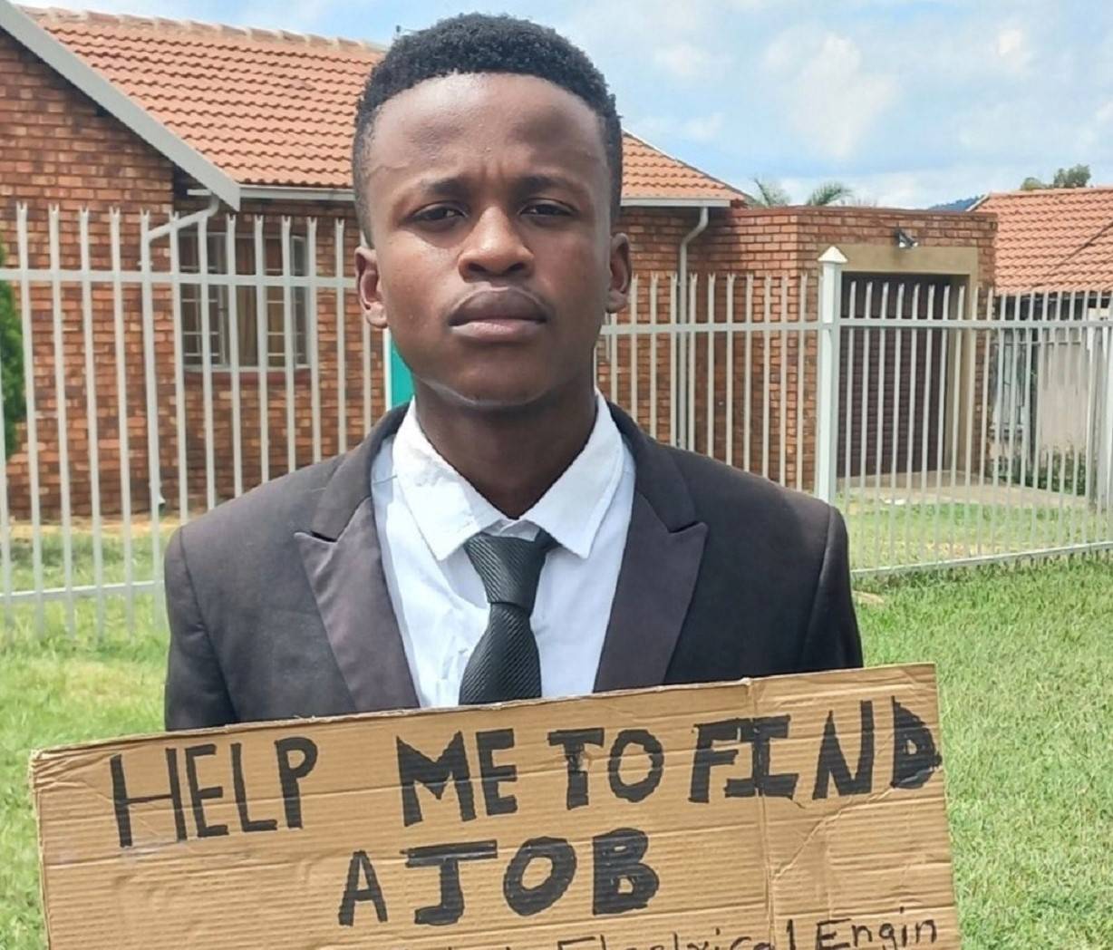 Momelezi Sifumba with a placard asking for a job on the streets of Pretoria. Photo: Supplied