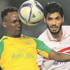 ON THE BALL:  Teko Modise of Mamelodi Sundowns clears the ball from Ali Gabr of Zamalek during their CAF Champions League match. (BackpagePix)