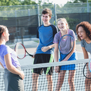Teens at a tennis court