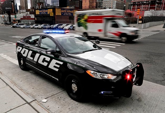 <b>GREEN-FRIENDLY COP CAR:</b> Ford says it will offer a police pursuit version of its hybrid Fusion sedan, in response to requests from US cities. <i>Image: AP / Julie Jacobson</i>
