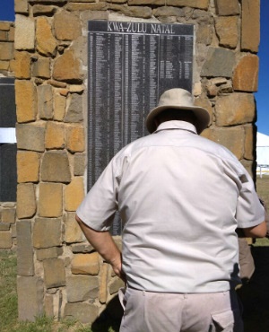 A farmer observes the names of farmers killed in farm attacks at the Wall of Remembrance in Nampo Park in Bothaville, Free State. (Amanda Khoza/News24)
