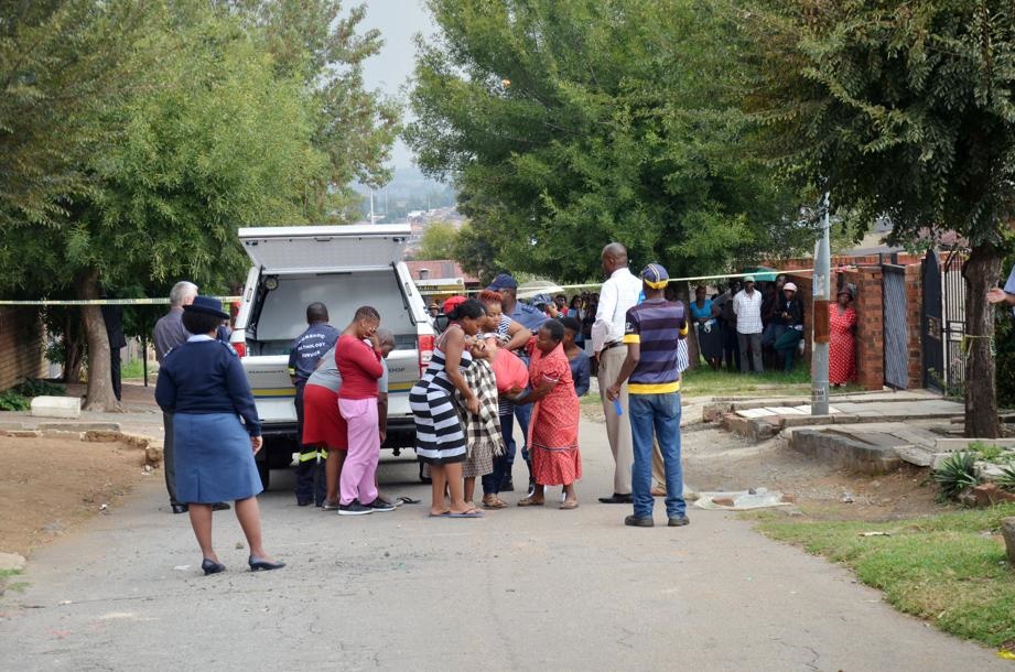 Heartbroken mum Rosina Mosioa was supported by women next to the mortuary van that took her son away. Photo by 
Zamokuhle Mdluli