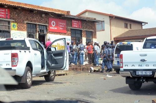 COPS STEP IN: Shops were looted in Katlehong, Mandela Section, after Somalians allegedly shot at people on Saturday. Police had to intervene.