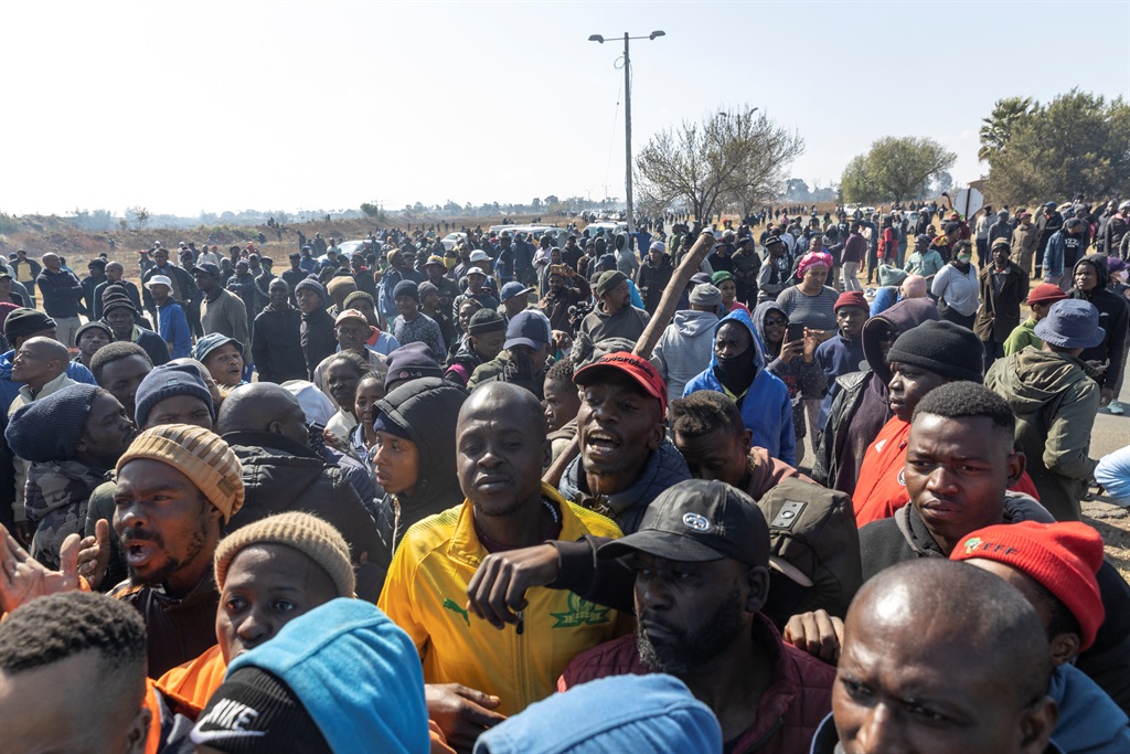 A large crowd of resident gathered amid protests against illegal miners in Kagiso. 