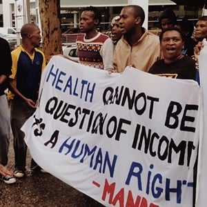 About 60 activists and patients protested outside the Sandton Holiday Inn as a UN panel reviews access to medicines. (Credit: Laura Lopez Gonzalez/Health-e News)