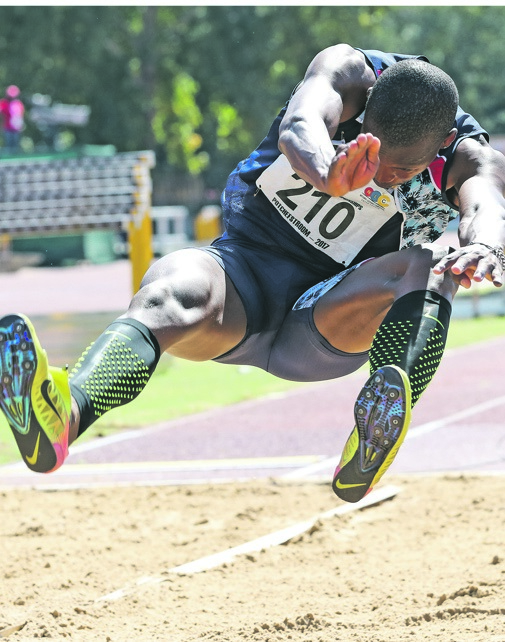 Luvo Manyonga flies through the air to set a new South African and African record in the long jump. Photo by BackpagePix