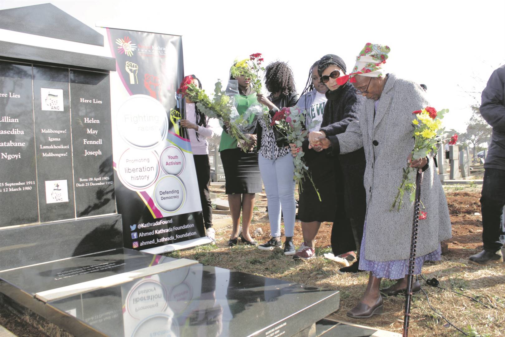 From right: Anti-apartheid activists Rita Ndzanga and Sophia Williams-De Bruyn laying flowers at the graves of fellow activists, Rahima Moosa, Albertina Sisulu, Helen Joseph and Lilian Ngoyi.  Photo by     Kgomotso Medupe