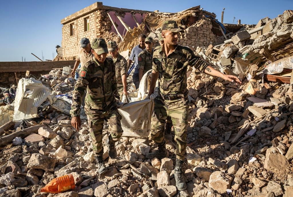 Moroccan Royal Armed Forces evacuate a body from a house destroyed in an earthquake in the mountain village of Tafeghaghte, southwest of the city of Marrakesh, on 9 September 2023.