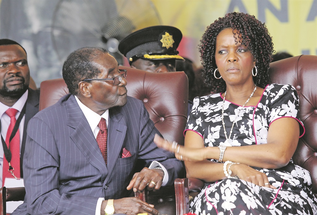 HUSH NOW President Robert Mugabe sits with his wife, Grace  PHOTO: AP 