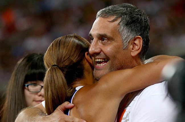 Jessica Ennis-Hill of Great Britain embraces coach Toni Minichiello after winning the Womens Heptathlon 800 metres and the overall Heptathlon gold during day two of the 15th IAAF World Athletics Championships Beijing 2015 at Beijing National Stadium on August 23, 2015 in Beijing, China.  (Photo by Cameron Spencer/Getty Images)