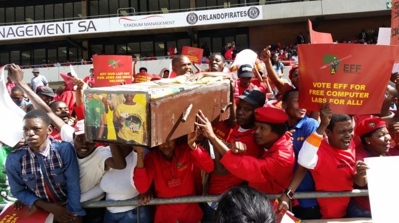 EFF supporters carrying a coffin bearing ANC colours. Photo by Christopher Moagi