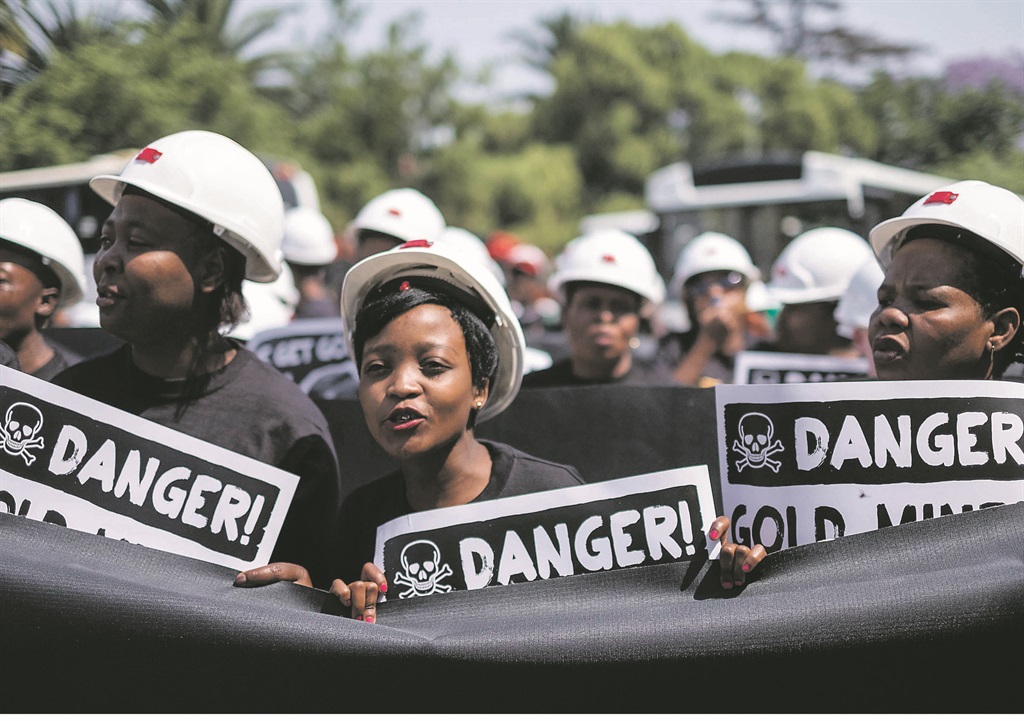 UNITED FRONT Members of the Treatment Action Campaign, Section27 and Sonke Gender Justice march through the streets of Johannesburg to hold corporations accountable for mine workers contracting silicosis. Picture: Shayne Robinson 