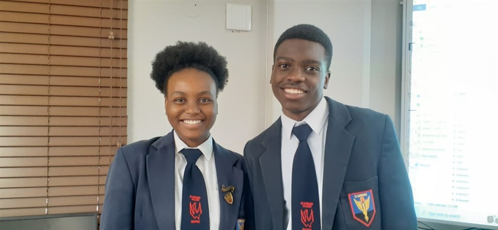 Boineelo Molusi and Tinotenda Ndarimani in school 