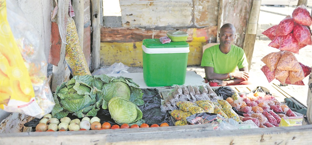  Thabang Moleleki is a partner in a street-corner stall selling fruit, snacks and cigarettes in Freedom Park, Rustenburg. Pictures: Lucky Nxumalo 