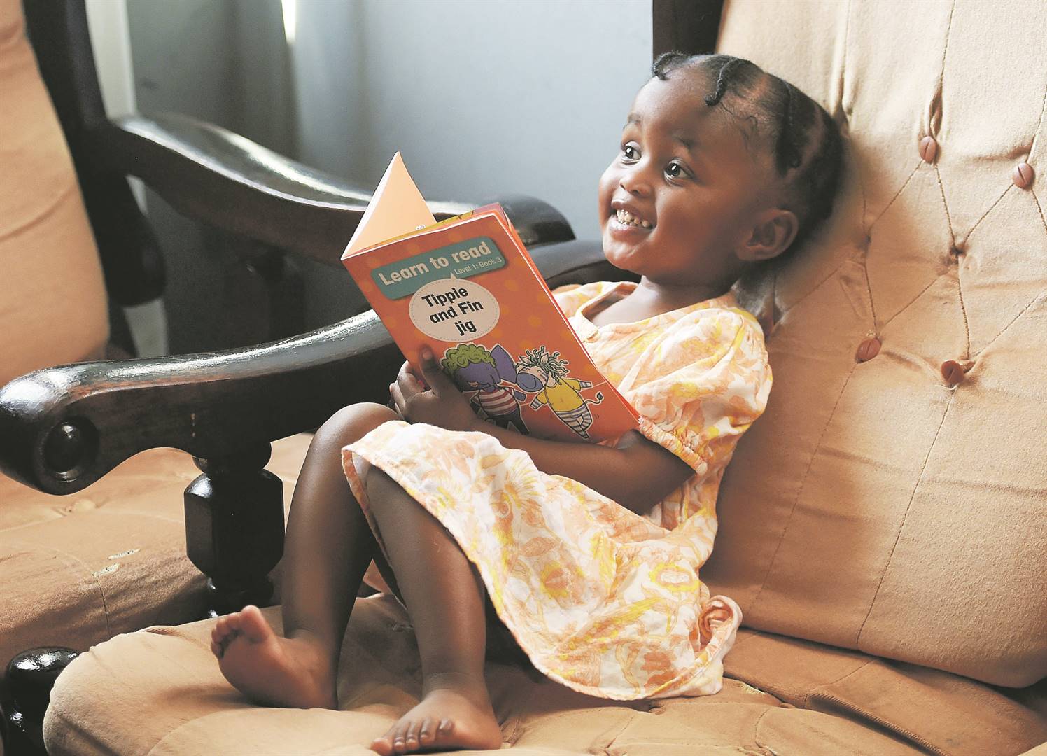 Little home-taught Lethukuthula Bhengu from Soweto can read fluently, count numbers and do addition.                           Photo by Trevor Kunene