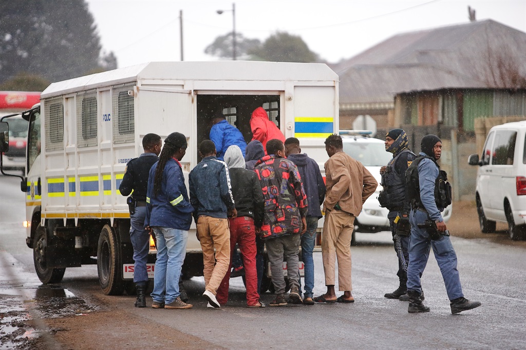 Police round up suspected zama zamas during a recent raid in Krugersdorp after eight women were raped in the area.