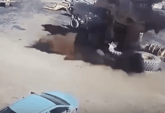 <b>COROLLA CRUSHED</b>A three tonne tyre completely flattens a Toyota Corolla after air-borne explosion. <i>GIF:Youtube</i>