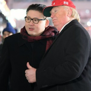 A man impersonating US President Donald Trump (R) and another impersonating Kim Jong Un. (MOHD RASFAN / AFP)