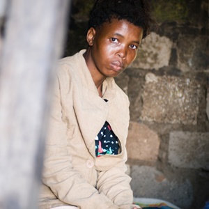 A photo of a woman taken inside a shack in South Africa. Source: iStockphoto.