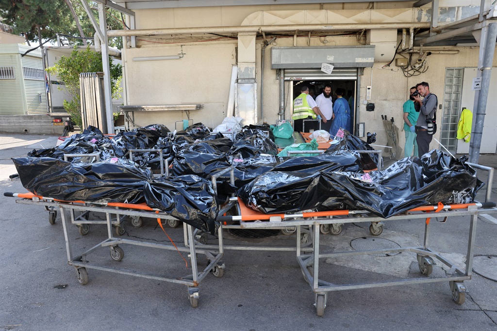 Bodies of people killed in the attack by Gaza-base