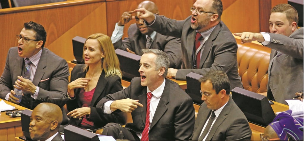 NO WAY Mmusi Maimane (bottom left corner), the leader of the official opposition DA, reacts with other party members as they voice their dissent about a decision by Speaker Baleka Mbete to temporarily suspend the Parliament session.  Picture: AP Photo / Schalk van Zuydam 