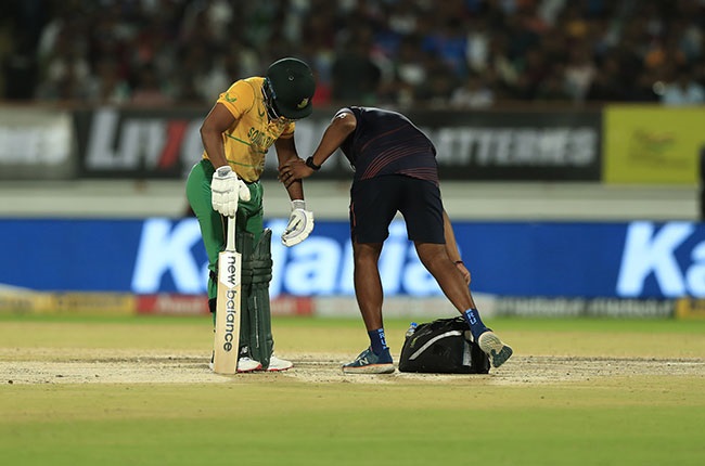 Temba Bavuma receives medical attention during the 4th T20 against India in June (Getty)