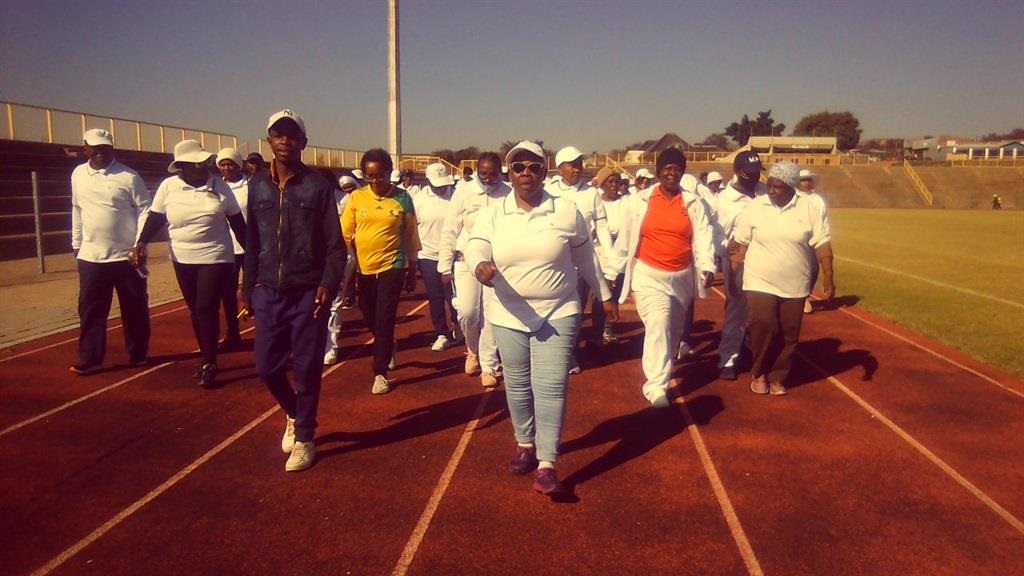 Gogos and mkhulus having a quick walk at Solomon Mahlangu Stadium. Photo by Bongani Mthimunye 