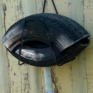 An 'ovillanta' is created from two 50 cm sections of an old car tire, fashioned into a mouth-like shape, with a fluid release valve at the bottom. Credit: Daniel Pinelo via http://medicalxpress.com/