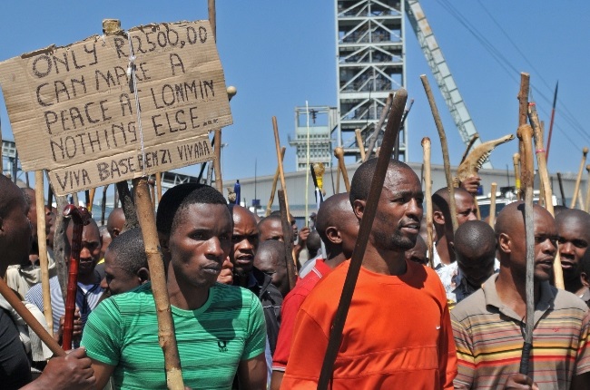 Lonmin mine workers march to three different mines on 10 September 2012, demanding that shafts be closed down and workers join them in their wage strike.