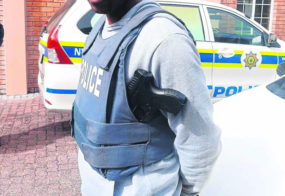 This man was bust wearing a cop bulletproof vest at Ramaphosa squatter camp in Philippi, Western Cape.                  Photo by Lulekwa Mbadamane 