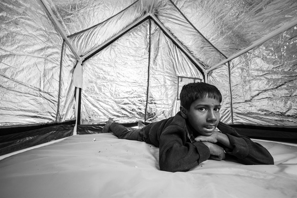 A little boy tests out the WeatherHYDE tent that could go a long way to saving people from unsafe homelessness. Picture: Supplied