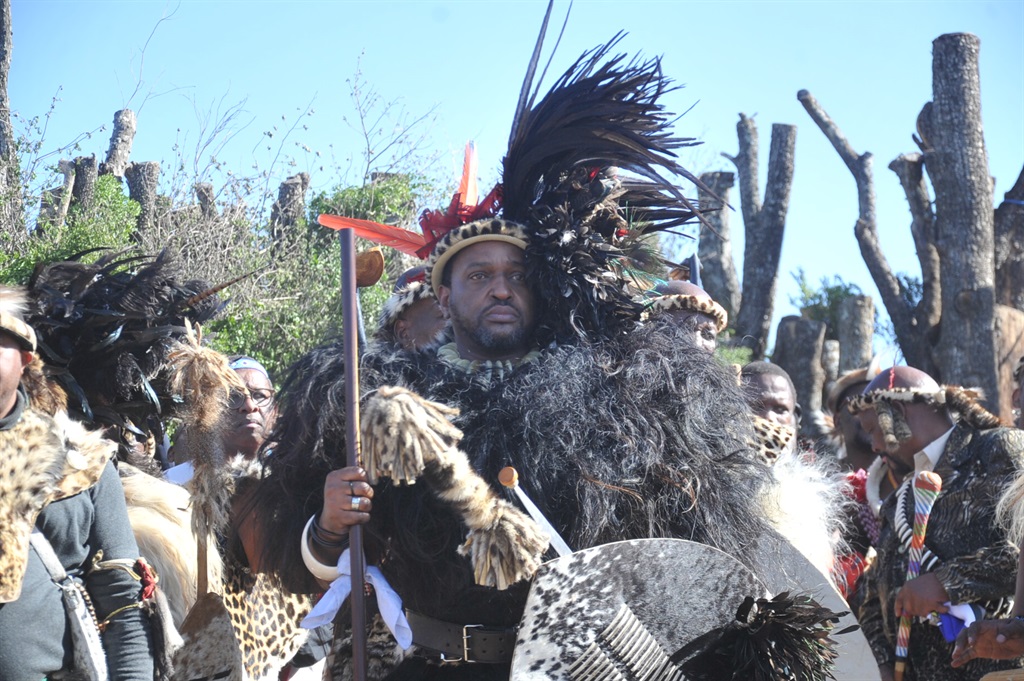 King Misuzulu raising his spear after during his traditional coronation.