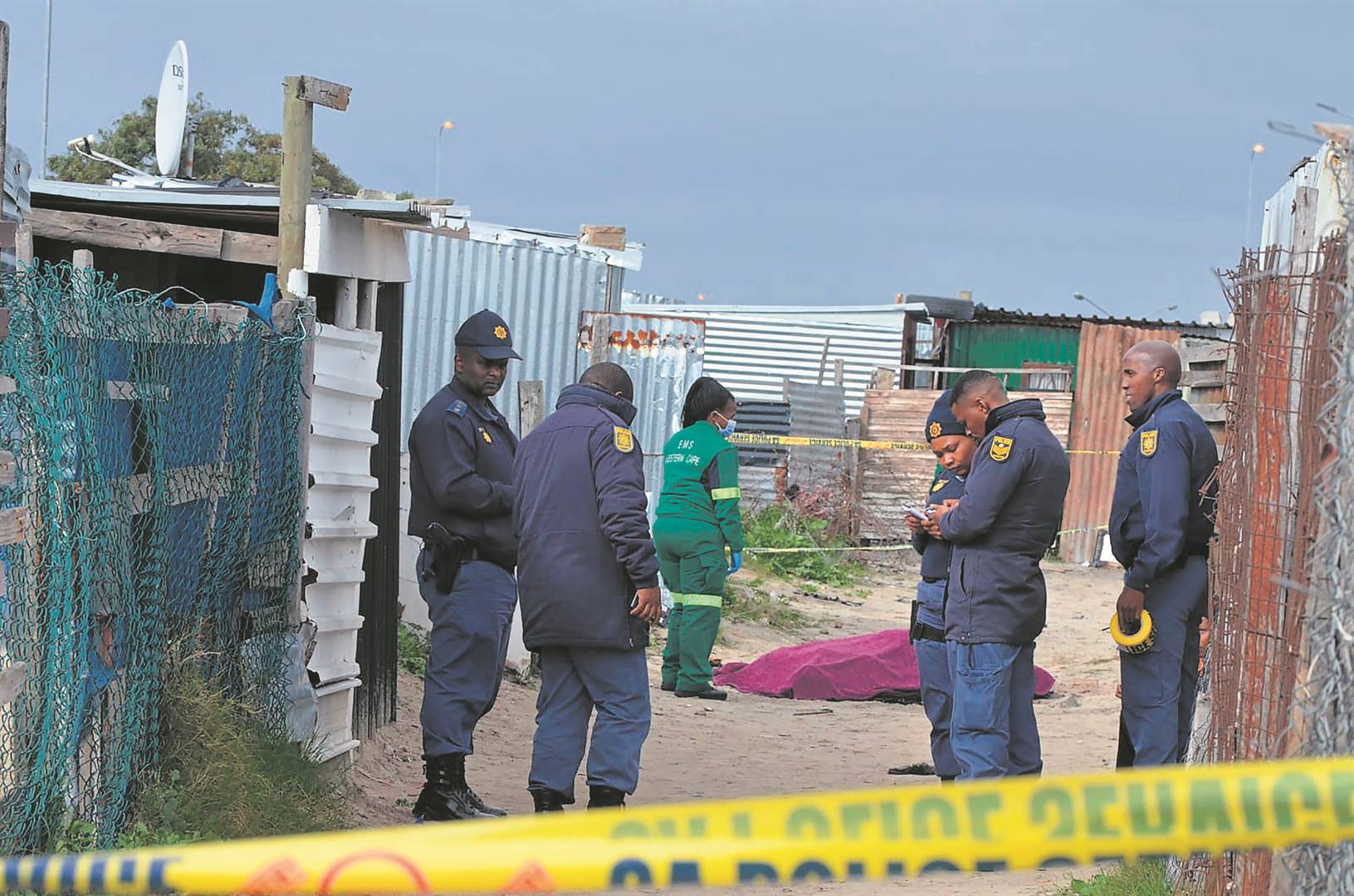 Cops at the scene of the murder incident in Lockdown squatter camp, Delft. Photo byLulekwa Mbadamane