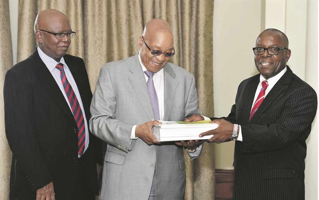 PLEASED AS PUNCH President Jacob Zuma receives the arms deal report from Judge Willie Seriti (right) and Judge Thekiso Musi, a member of the Arms Procurement Commission. Picture: Elmond Jiyane / GCIS 