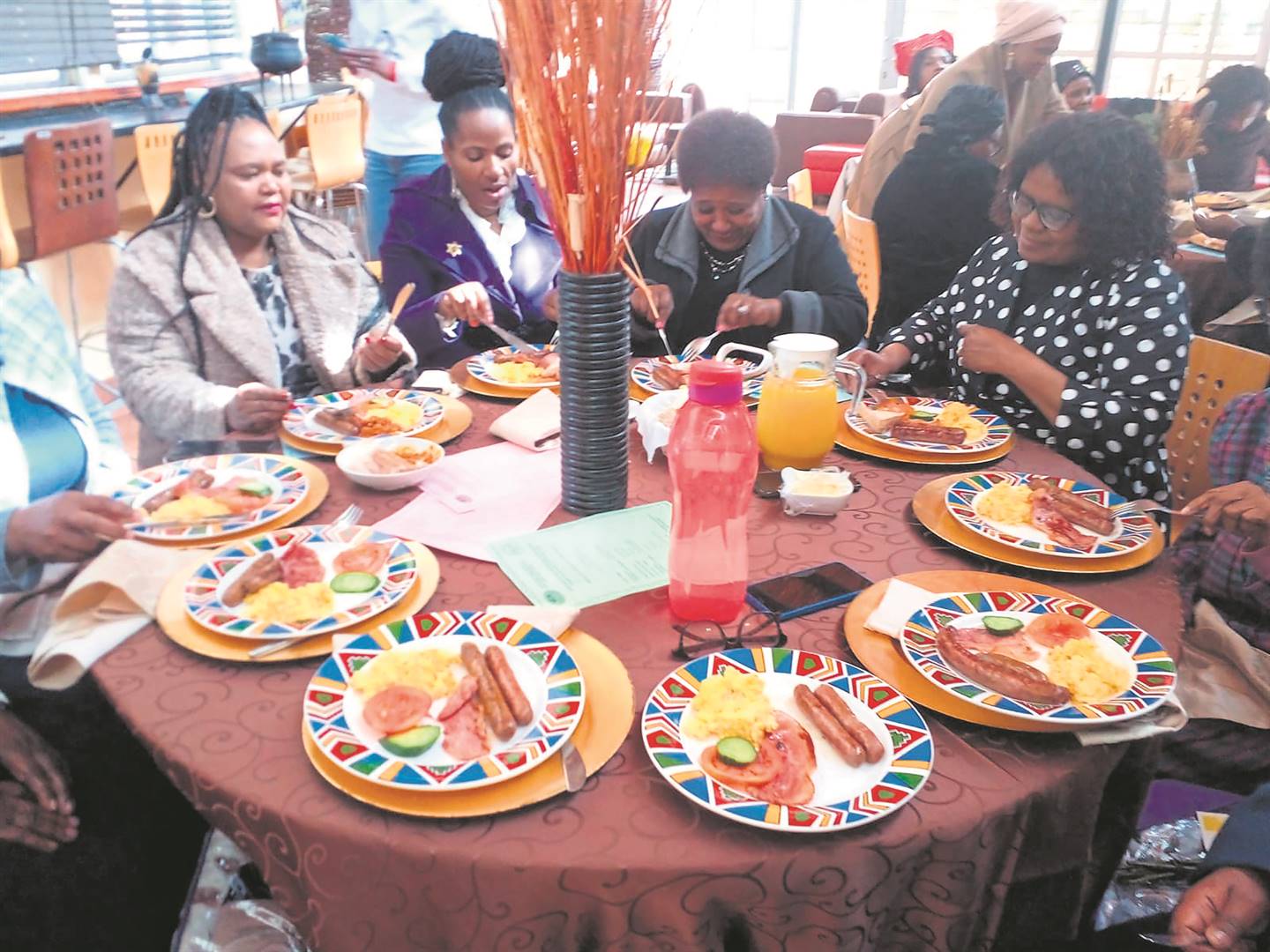 Widows enjoying breakfast at Malibongwe restaurant in Lookout Hill, Khayelitsha at the weekend.                  Photo by Lulekwa Mbadamane