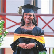 Graduate dedicates top achievement to parents