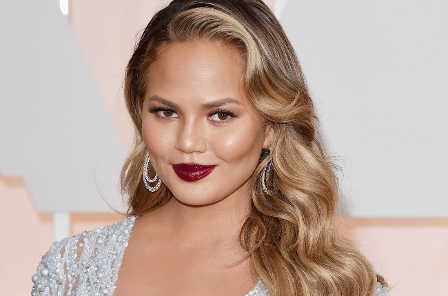 Chrissy Teigen is serving baby-bump content on her family vacation. (PHOTO: Getty Images)