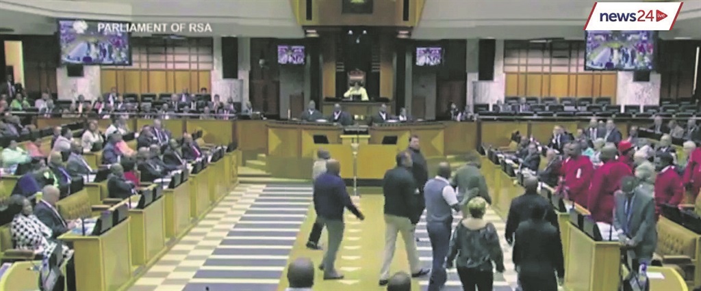 Parliamentary security police closed in to remove members of the EFF from the house after they refused to allow President Jacob Zuma to address parliament, saying he was in office illegitimately.                                    