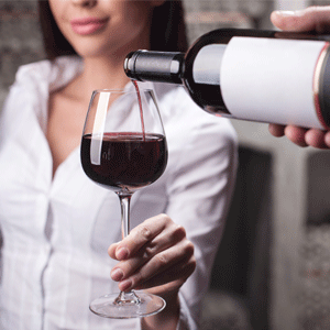 Woman having a glass of wine