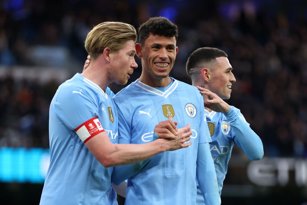 MANCHESTER, ENGLAND - JANUARY 07: Kevin De Bruyne and Matheus Nunes of Manchester City celebrate after teammate Jeremy Doku (not pictured) scores their teams fifth goal during the Emirates FA Cup Third Round match between Manchester City and Huddersfield Town at Etihad Stadium on January 07, 2024 in Manchester, England. (Photo by Clive Brunskill/Getty Images)