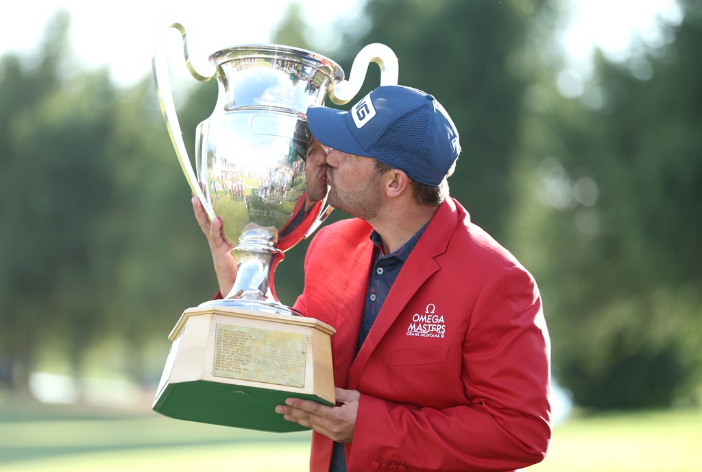 South Africa’s Thriston Lawrence poses with the trophy after winning the European Masters at Crans-sur-Sierre Golf Club on 28 August 2022. (Photo by Richard Heathcote/Getty Images)