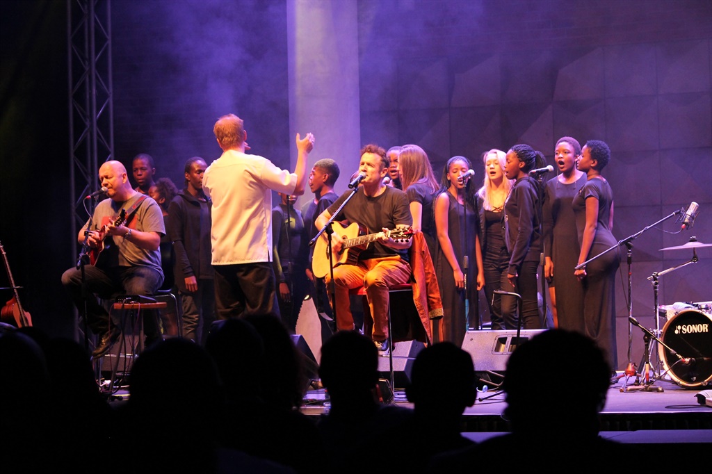 Johnny Clegg performs a moving version of The Crossing with the Lebone II College Choir. It is the first time he has performed with a school choir. Picture by Kabelo Langa