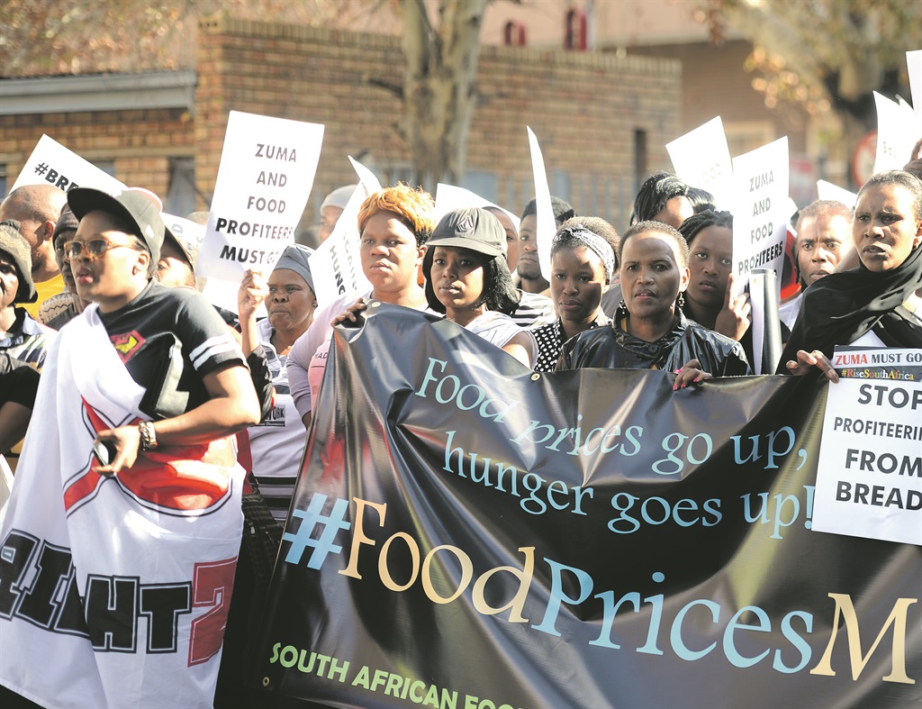 TOUGH TIMES Protesters march in downtown Johannesburg on Friday to protest against the rising price of staple foods, particularly bread and mealie meal. Former Cosatu general secretary Zwelinzima Vavi was at the march. Picture: Lucky Nxumalo 