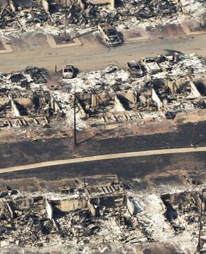 This aerial photo shows a devastated neighbourhood in Fort McMurray. (Jason Franson, The Canadian Press via AP) 