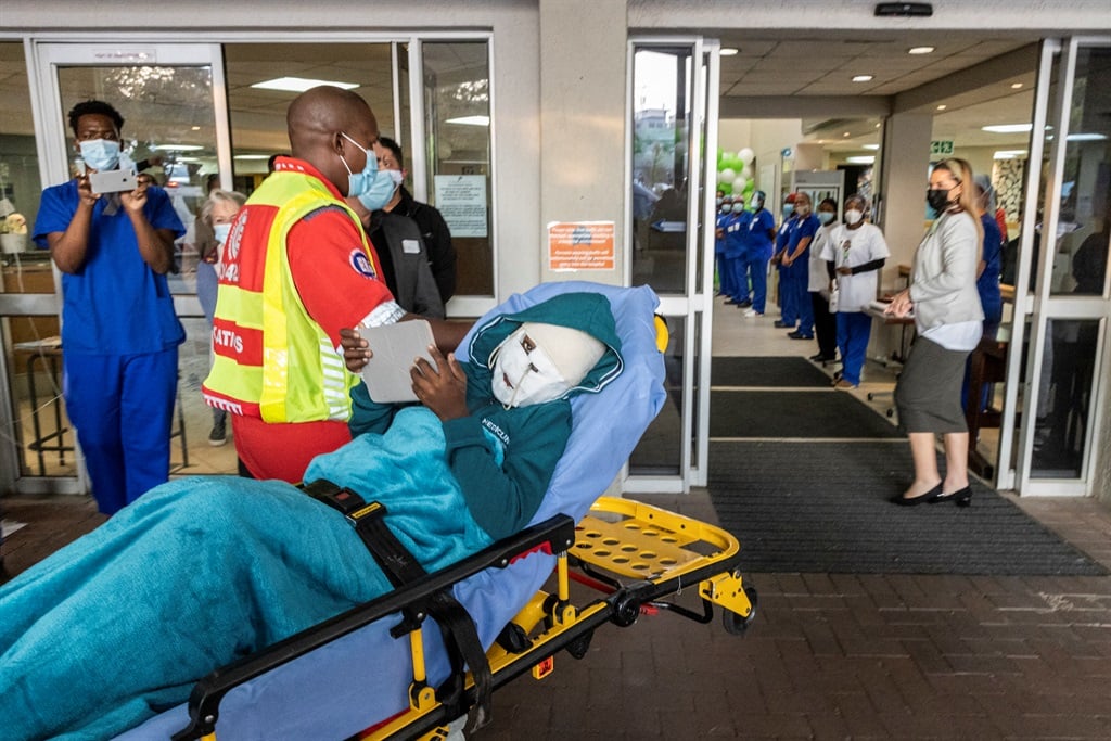 Rodwell Khomazana being taken into the hospital on a gurney at Mediclinic Sandton.